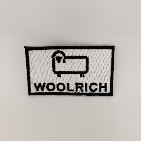 Toppe Woolrich Logo